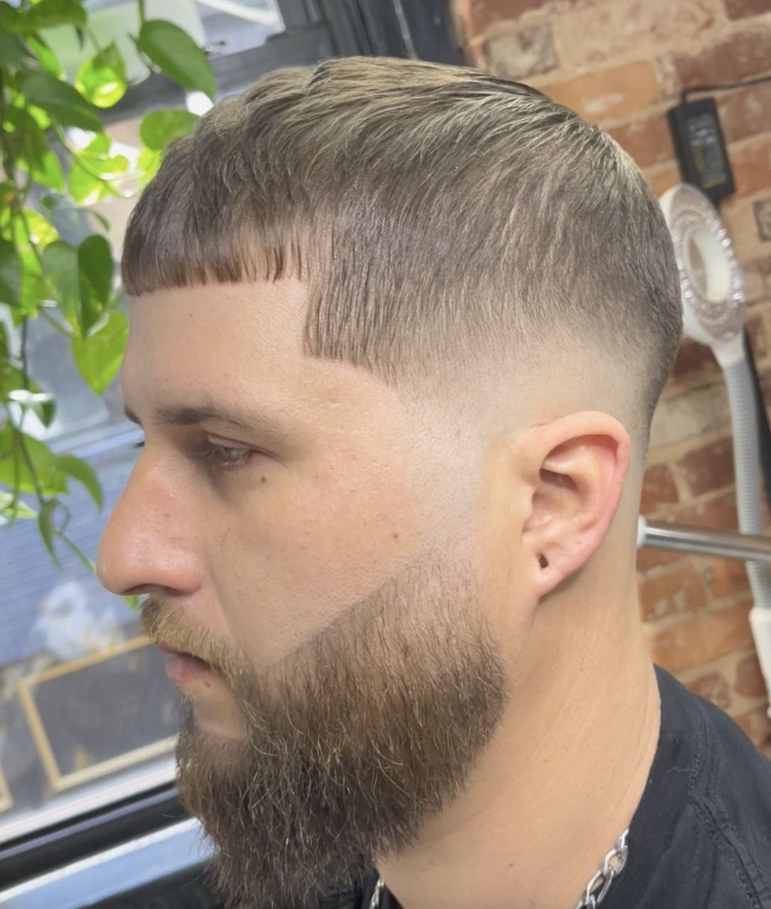 Sharp mid fade with beard blend
